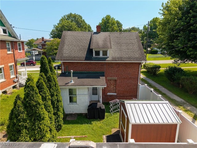 601 W 3rd St, Williamstown, WV 26187 - rear view of property featuring a chimney and brick siding