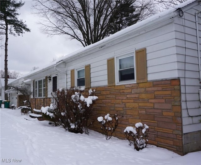 view of front of home featuring stone siding