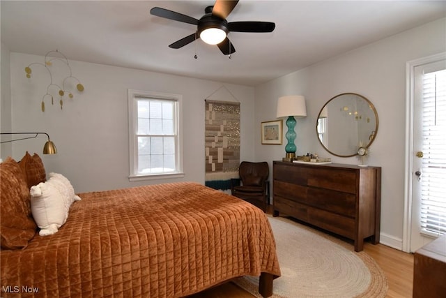 bedroom featuring light wood-style flooring and ceiling fan