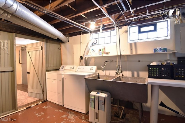 laundry room featuring laundry area, electric panel, and separate washer and dryer