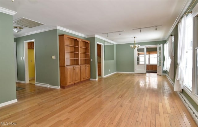 unfurnished living room with light wood-style floors, a baseboard radiator, and crown molding