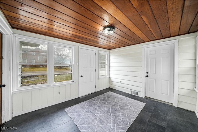 unfurnished sunroom with wooden ceiling and visible vents