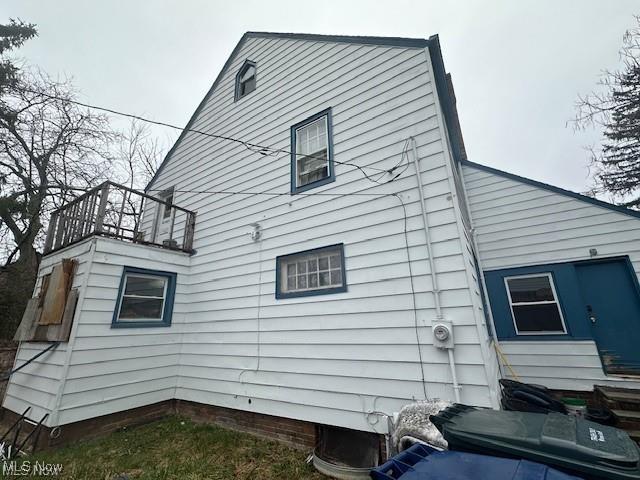 back of property with a balcony