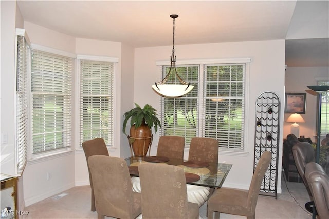 dining area featuring baseboards