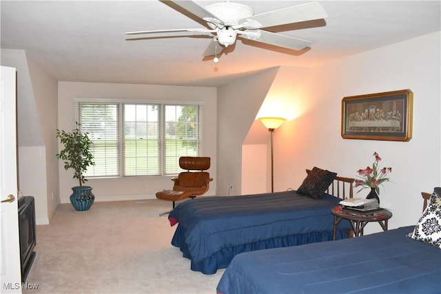 bedroom featuring a ceiling fan and light carpet