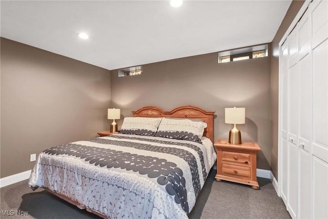 bedroom featuring baseboards, dark colored carpet, a closet, and recessed lighting