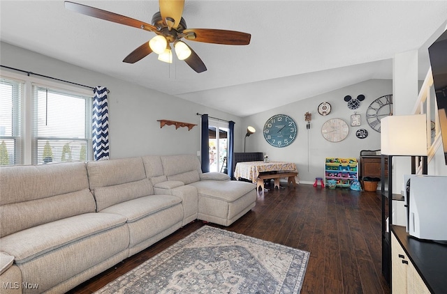 living area with vaulted ceiling, ceiling fan, a wealth of natural light, and hardwood / wood-style floors