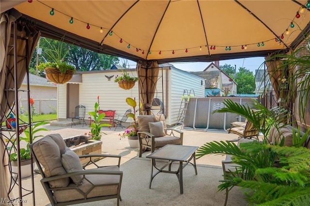 view of patio / terrace with outdoor lounge area and a gazebo