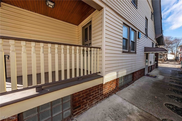 view of side of home with a balcony