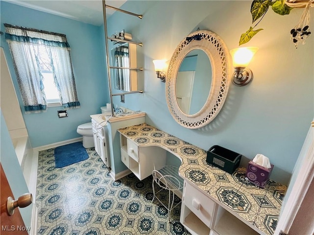full bathroom featuring baseboards, vanity, toilet, and tile patterned floors