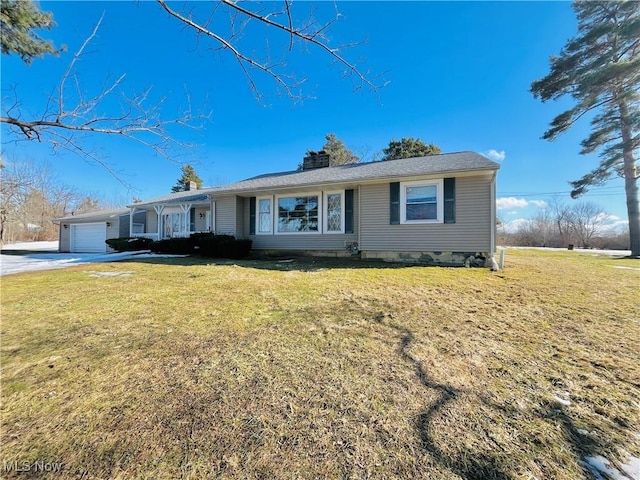 single story home featuring an attached garage, driveway, a chimney, and a front lawn