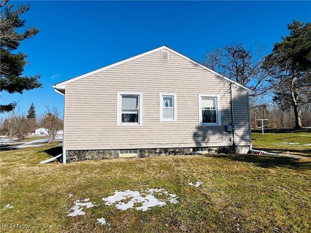 view of home's exterior featuring a yard