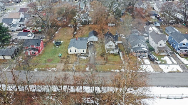 snowy aerial view featuring a residential view