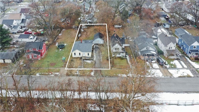 snowy aerial view featuring a residential view