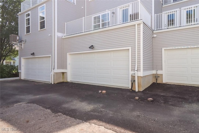 garage featuring driveway