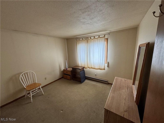 unfurnished room with a baseboard radiator, a textured ceiling, baseboards, and carpet flooring