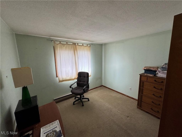 office with a textured ceiling, carpet, and baseboards