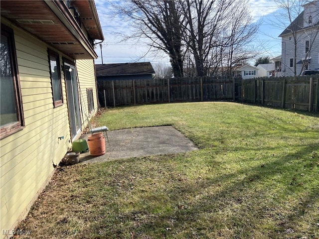 view of yard with a fenced backyard and a patio