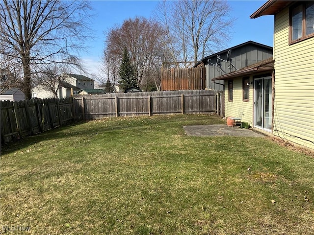 view of yard with a fenced backyard and a patio