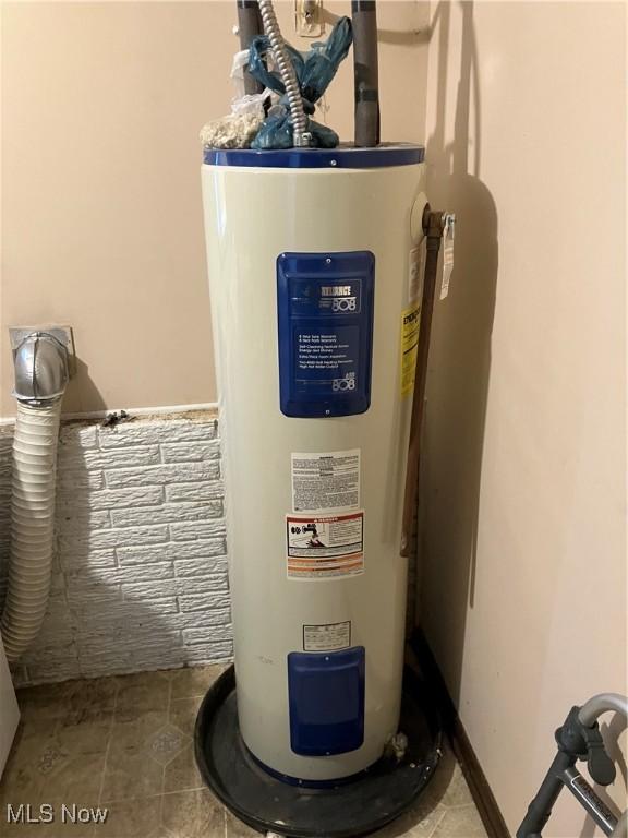 utility room featuring electric water heater