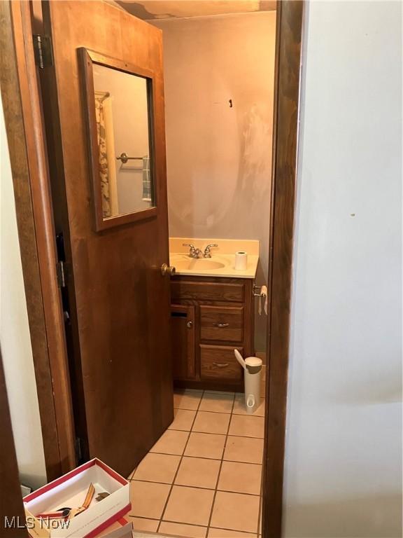 bathroom with tile patterned flooring and vanity