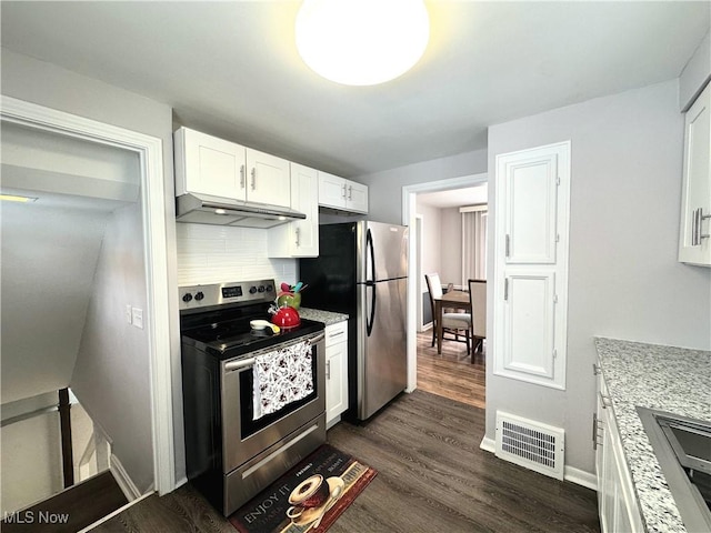 kitchen featuring visible vents, white cabinets, dark wood finished floors, stainless steel appliances, and under cabinet range hood