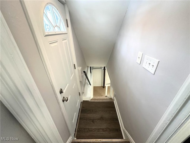 stairway with wood finished floors