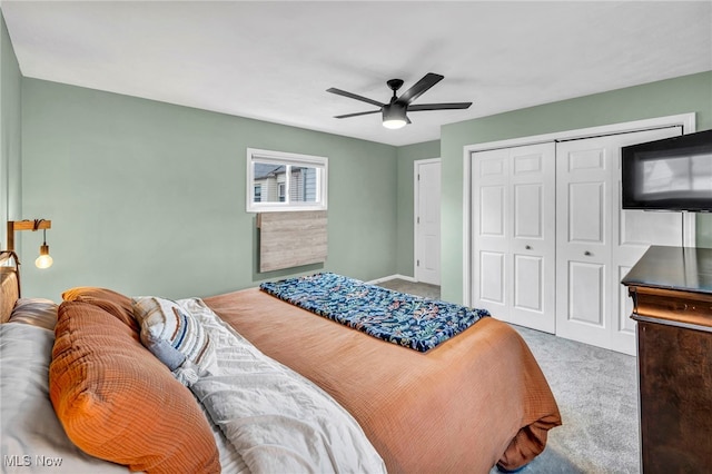 bedroom with a closet, a ceiling fan, and carpet flooring