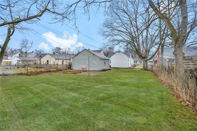 view of yard with fence and a residential view