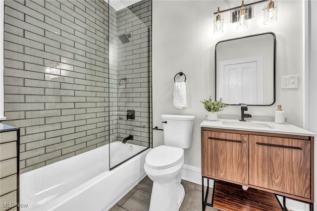 full bathroom featuring toilet, shower / bath combination, vanity, baseboards, and tile patterned floors