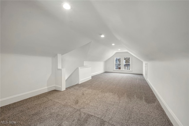 additional living space featuring lofted ceiling, recessed lighting, carpet flooring, and baseboards