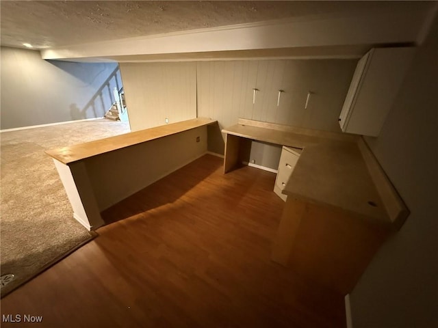 interior space featuring built in study area and wood finished floors