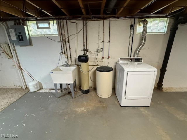 interior space with washer / clothes dryer, electric panel, and a sink