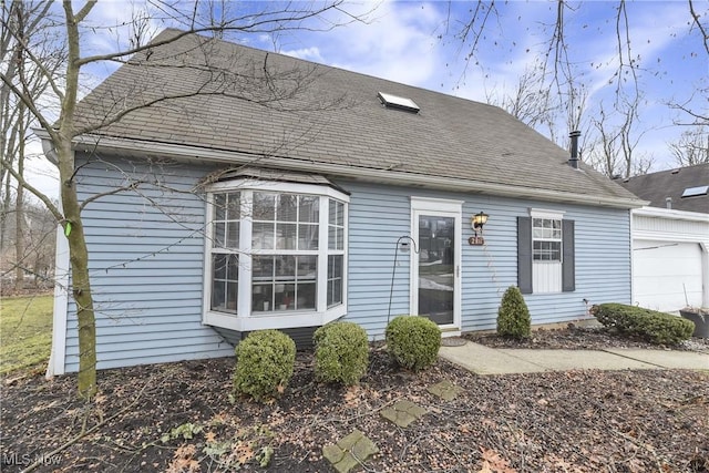 view of front of home featuring a shingled roof