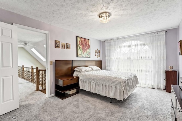 carpeted bedroom featuring a textured ceiling