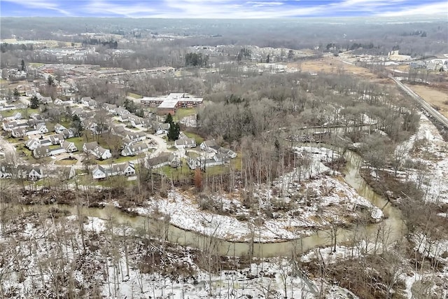 snowy aerial view with a residential view