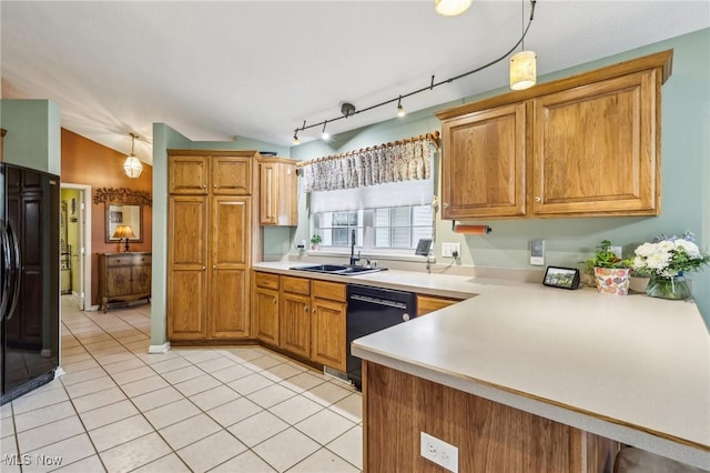 kitchen with black appliances, light tile patterned floors, vaulted ceiling, and a sink