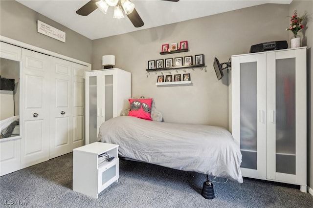 carpeted bedroom with ceiling fan and a closet