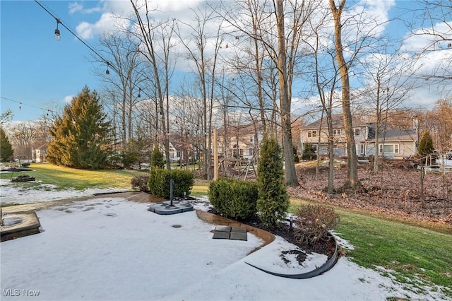 view of community featuring a residential view and a lawn