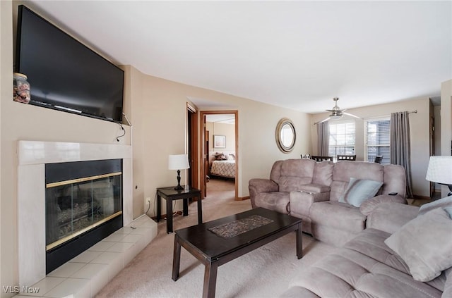 living area with a fireplace and light colored carpet