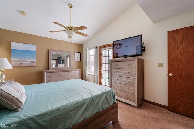 carpeted bedroom with vaulted ceiling, ceiling fan, and baseboards