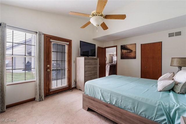 bedroom with light carpet, multiple windows, visible vents, and access to exterior