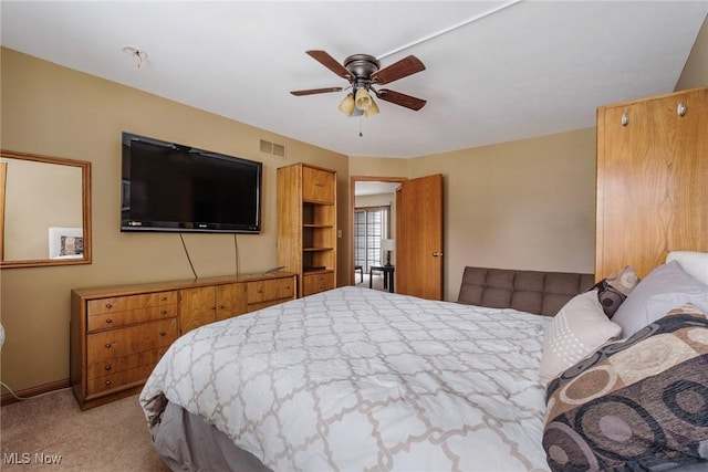 bedroom featuring carpet, visible vents, and a ceiling fan