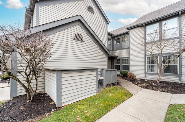 view of side of property with a garage