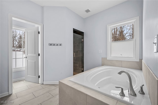 10565 Valley View Rd, Sagamore Hills, OH 44067 - bathroom with a garden tub, a stall shower, and tile patterned floors