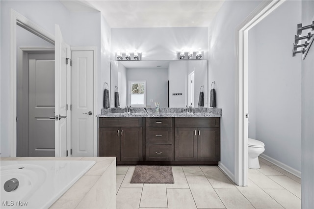 10565 Valley View Rd, Sagamore Hills, OH 44067 - bathroom with double vanity, toilet, tile patterned flooring, a tub to relax in, and baseboards