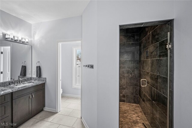 10565 Valley View Rd, Sagamore Hills, OH 44067 - full bathroom featuring vanity, tile patterned flooring, a shower stall, toilet, and baseboards