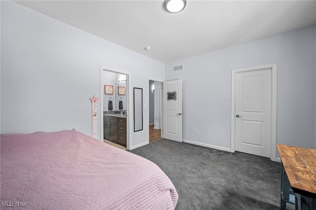 10565 Valley View Rd, Sagamore Hills, OH 44067 - bedroom featuring dark carpet, ensuite bathroom, and baseboards
