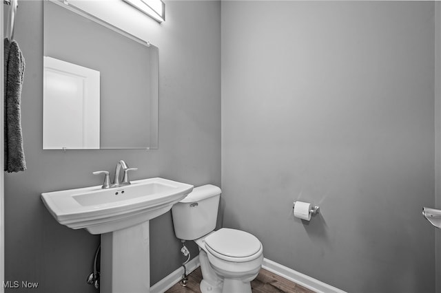 10565 Valley View Rd, Sagamore Hills, OH 44067 - bathroom featuring toilet, wood finished floors, and baseboards