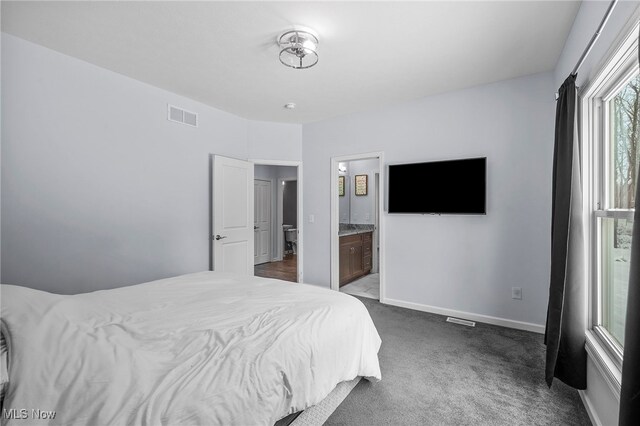 10565 Valley View Rd, Sagamore Hills, OH 44067 - bedroom with carpet floors, baseboards, and ensuite bathroom